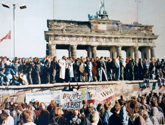 Germans at the Brandenburg Gate, November 1989 — the Wall that killed 140 people finally falls